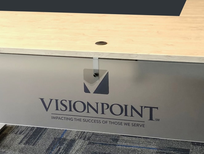 custom visionpoint logo on rev.247 desk