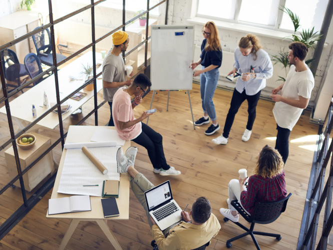 team using white board in meeting